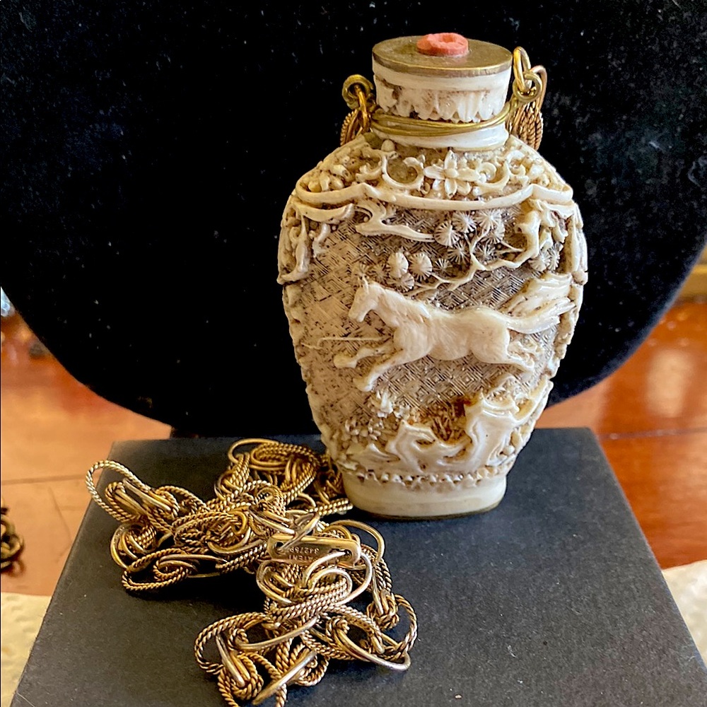 Hobe Intricately Carved Snuff Bottle with Intricate Chain. Gold Tone